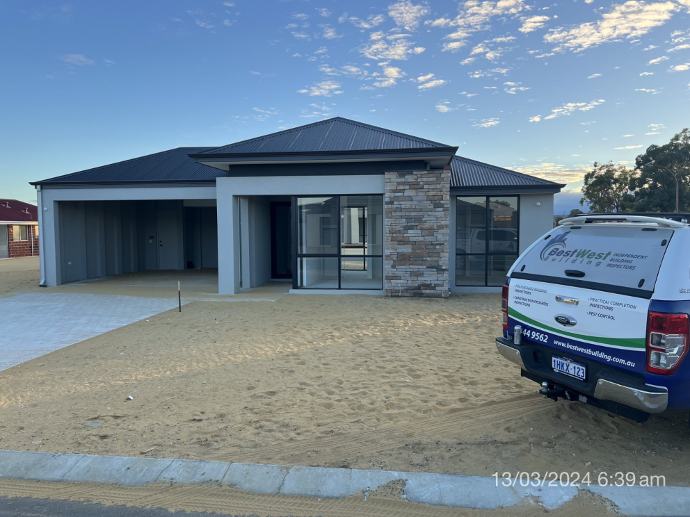 Inspector assessing Practical Completion Inspection during a new build stage inspection in Perth